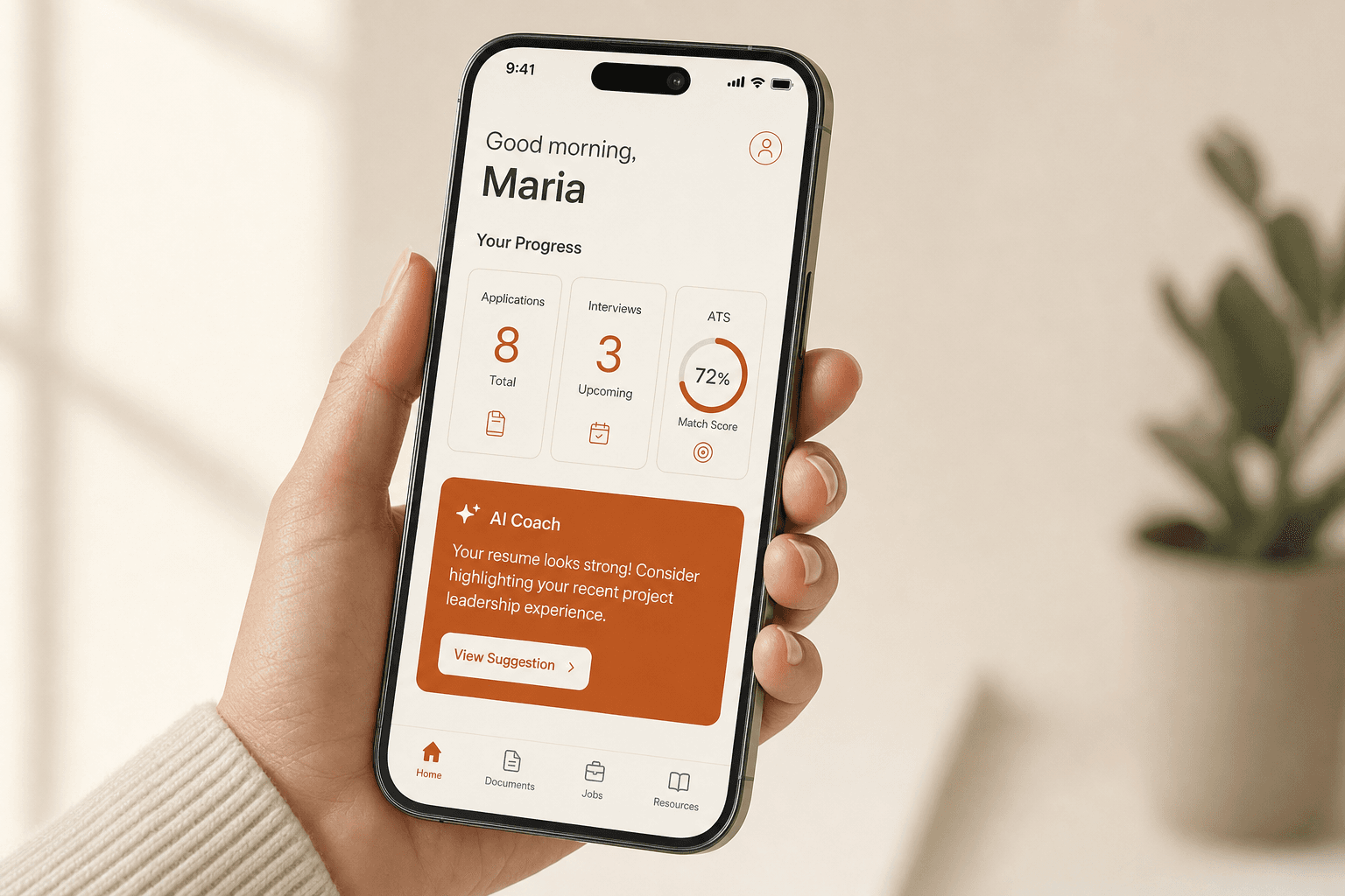iPhone in hand showing the NextStep dashboard with three stat tiles and an AI Coach suggestion